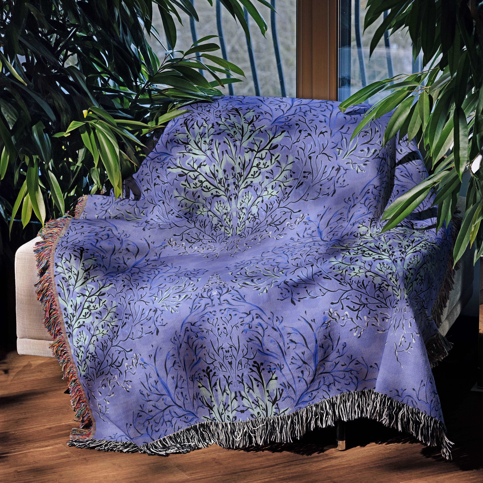 Blue coral fabric design on a throw