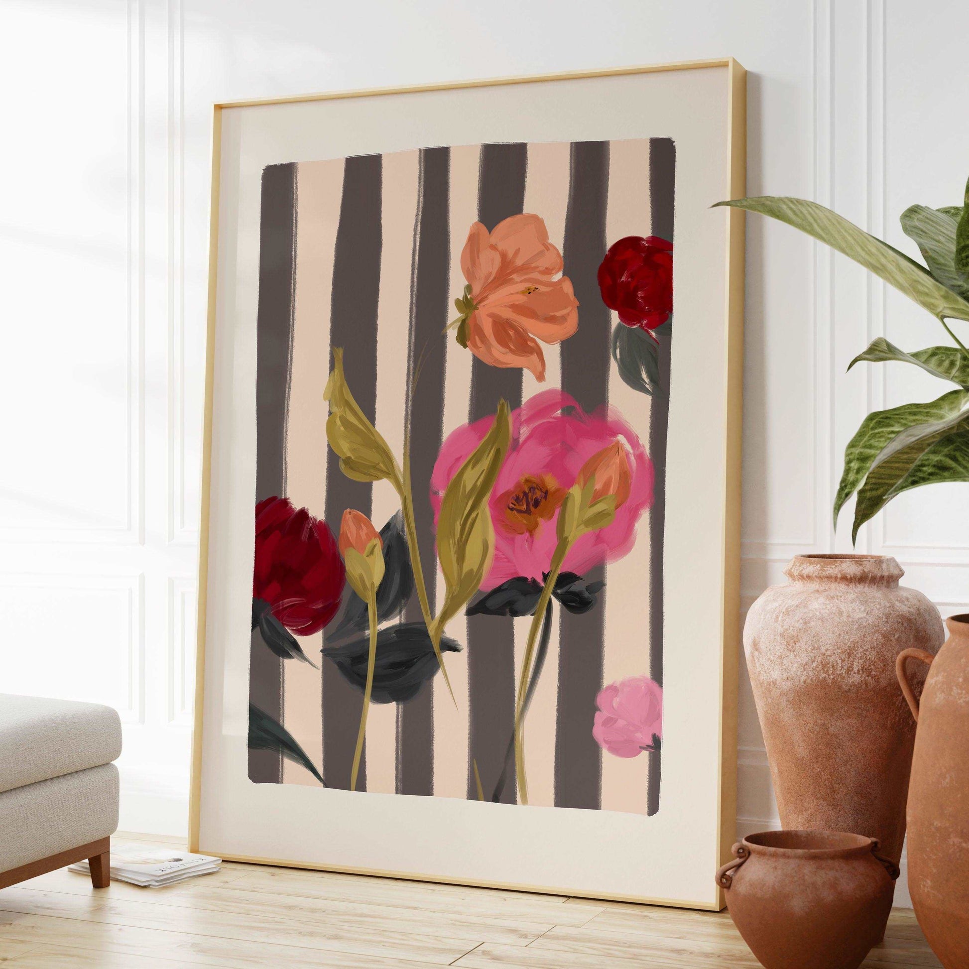 A painterly mix of pink and red roses art print on a striped cream and navy background