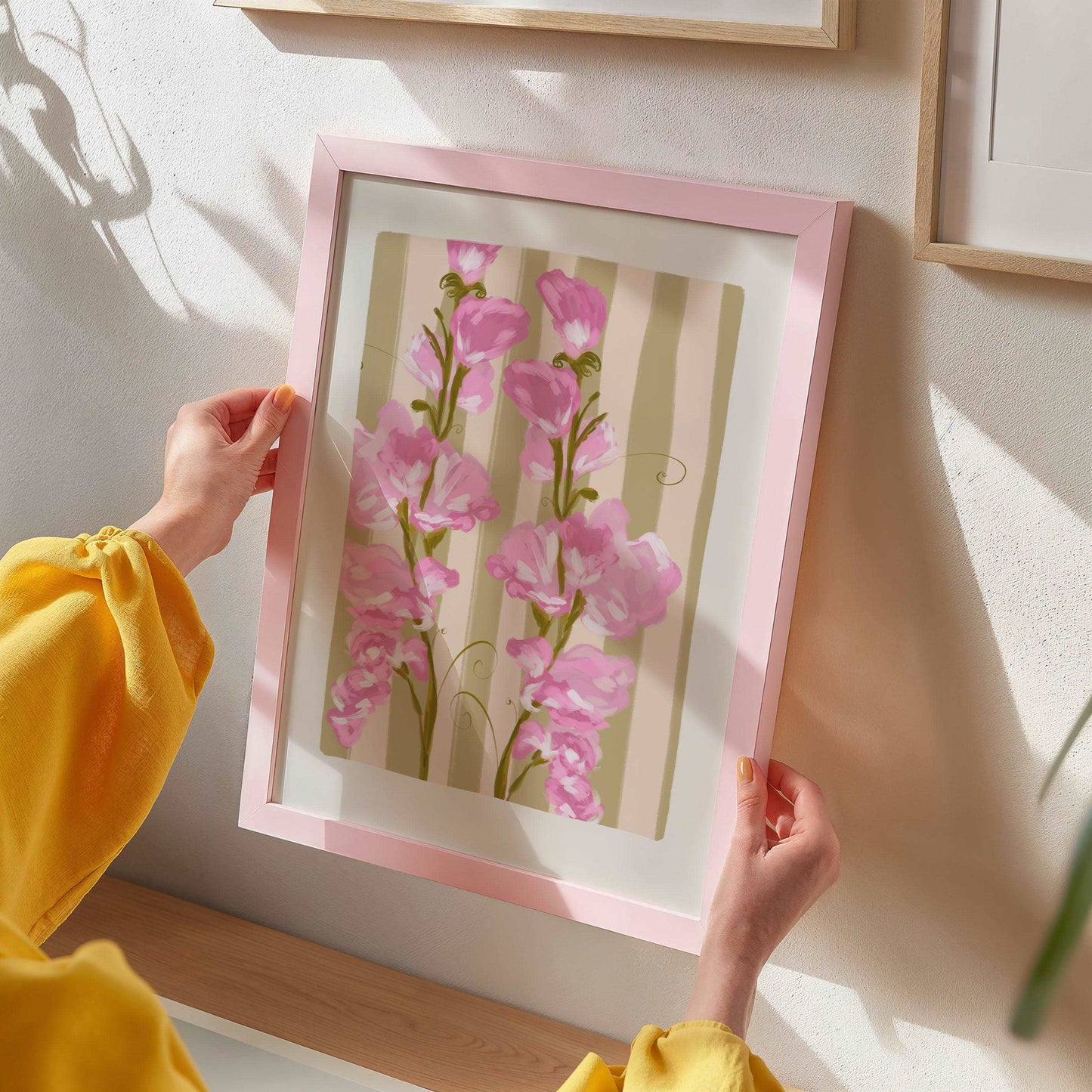 Colourful April birth flower art print featuring painted pink sweet pea flowers on a striped olive green background.