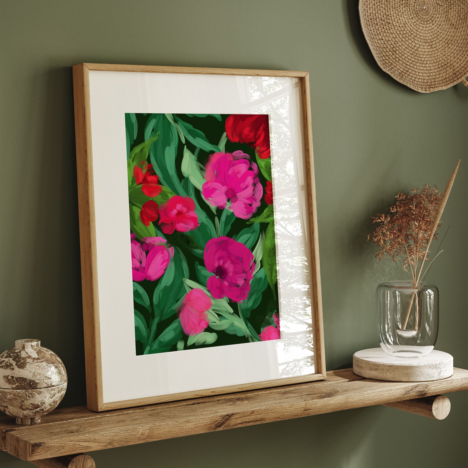 A colourful botanical illustration featuring vibrant pink flowers and red blooms with dense green leaves on a dark green canvas.