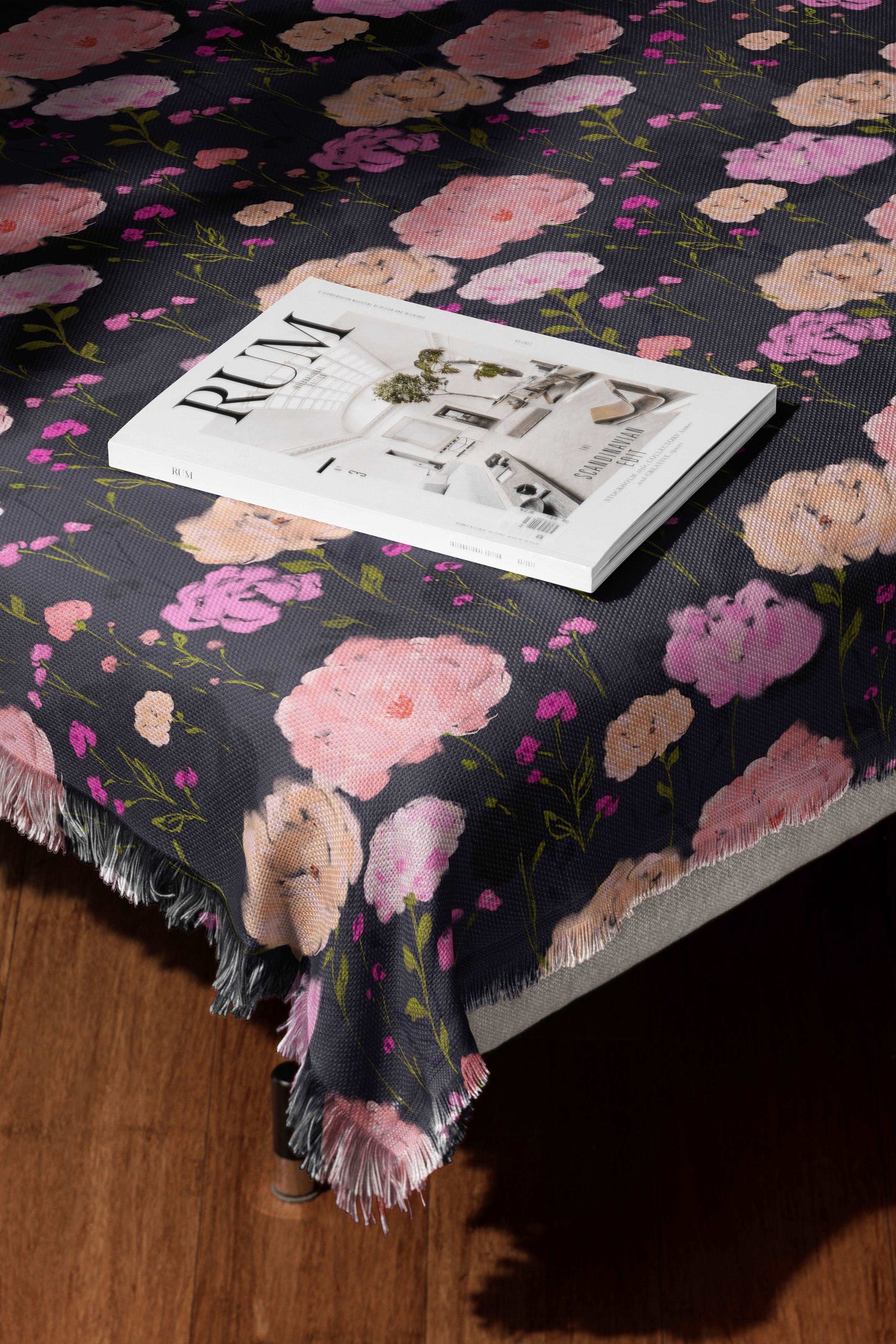 Dark purple floral pattern on a bed cover