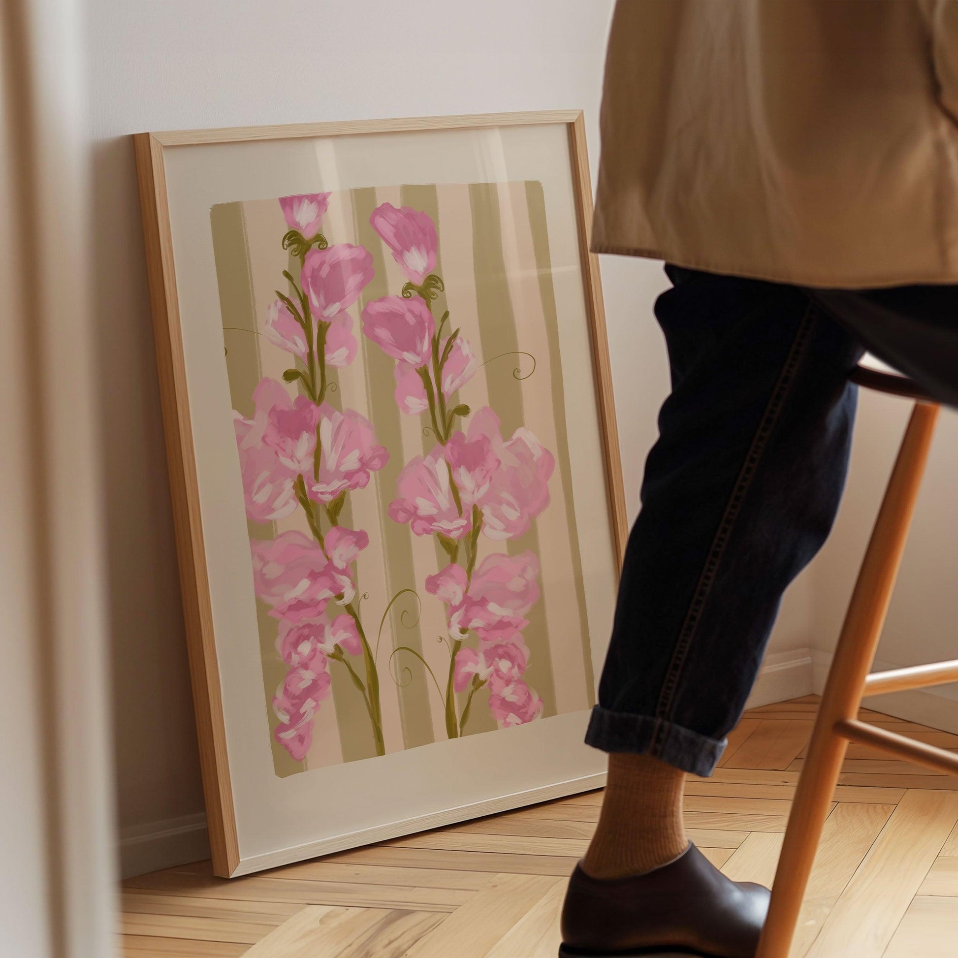 Colourful April birth flower art print featuring painted pink sweet pea flowers on a striped olive green background.