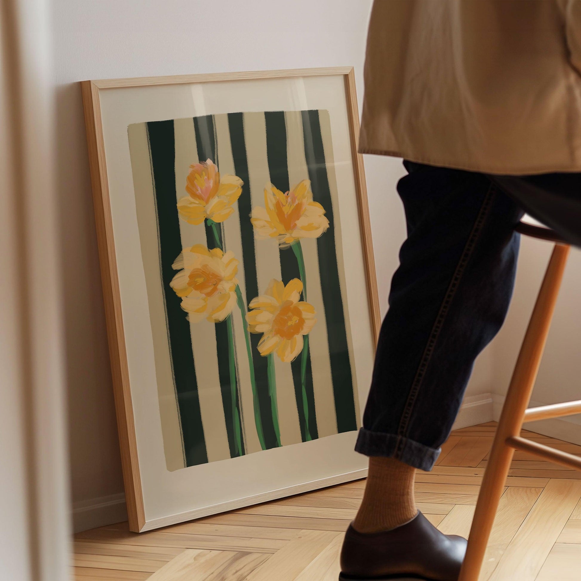 Yellow Narcissus flowers art print on a striped navy and cream background.