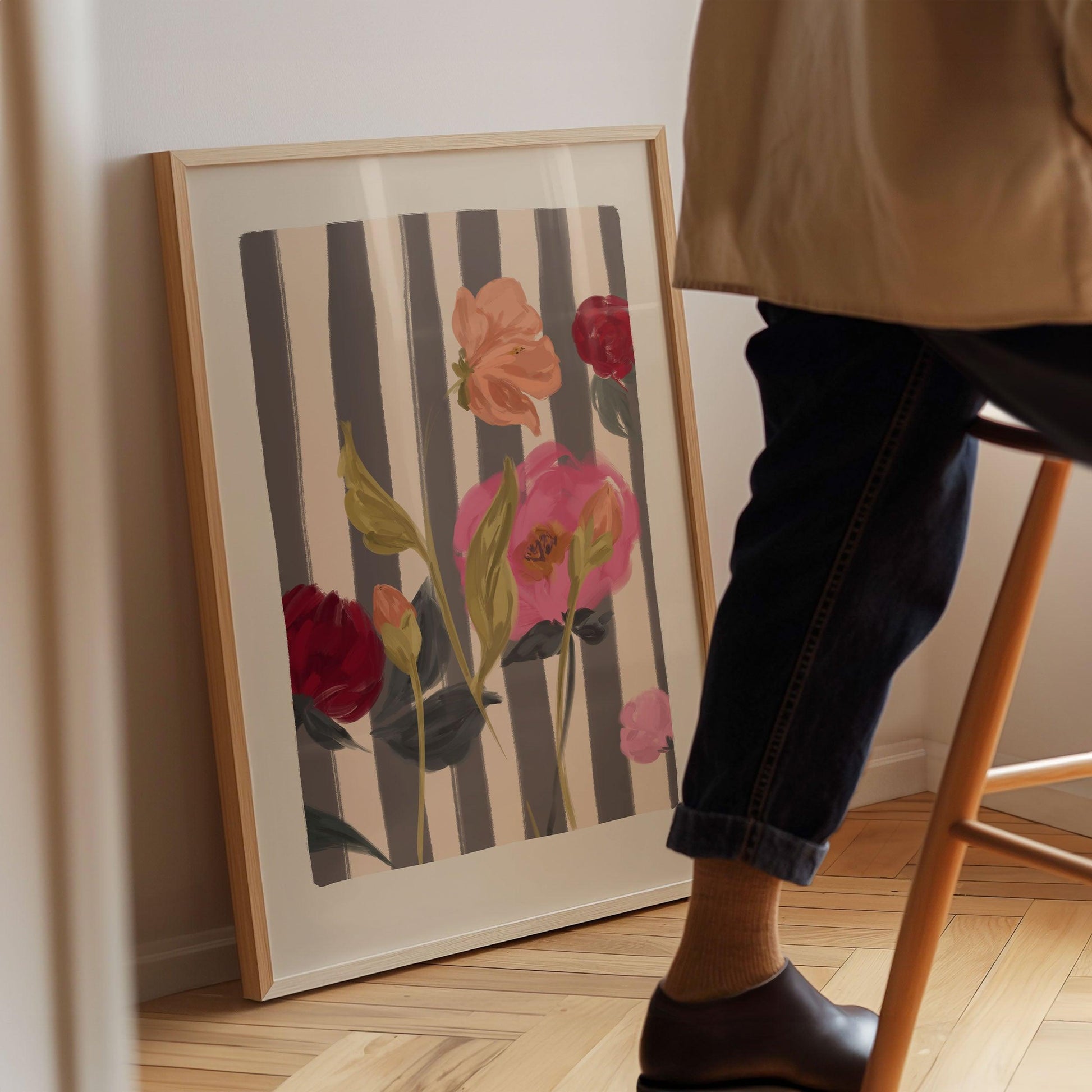 A painterly mix of pink and red roses art print on a striped cream and navy background