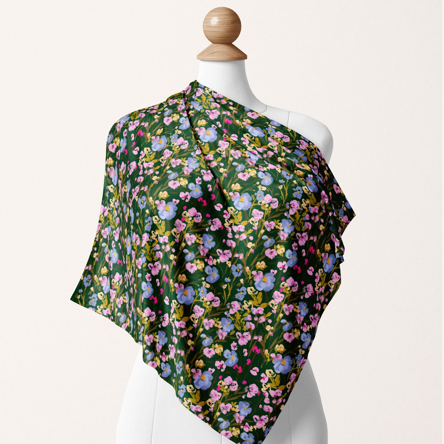 Forest green, blue, pink and yellow ditsy floral textile design on a silk scarf